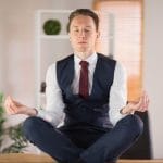business man meditating
